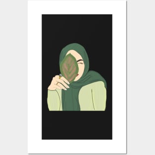 Hijabi Muslim Woman holding a Leaf Posters and Art